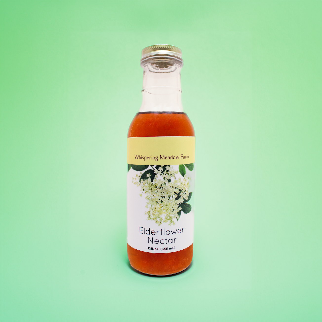 Product Image of 12 fluid ounce bottle of orange Elderflower Nectar.